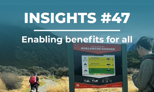 A young autistic man reads the interpretation panel at Mueller Hut track, Aoraki/Mt Cook. Photo: L Atkinson 2024