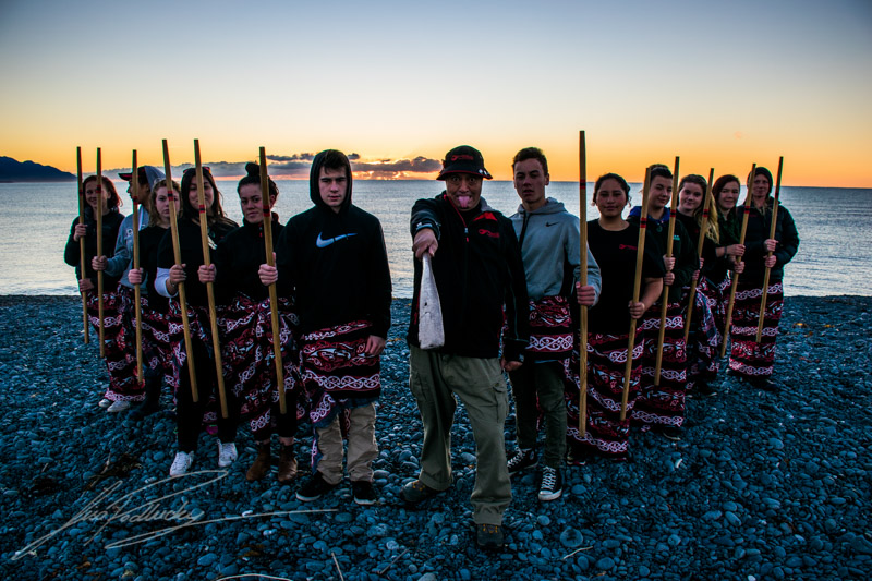 Group of people standing in twilight