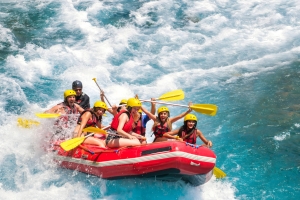 A group of people are rafting on white water