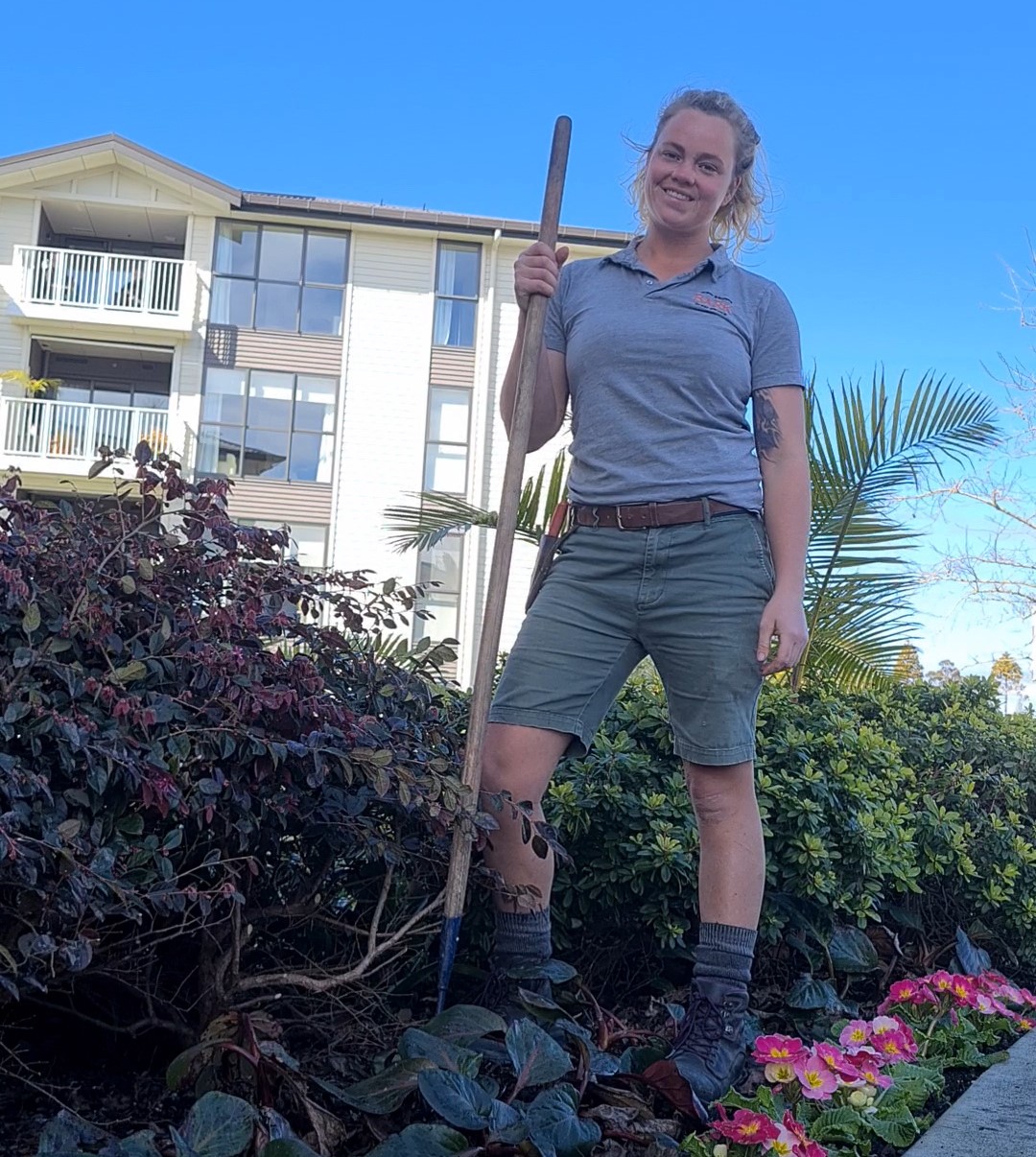 Renee Johnson smiling while in a garden working