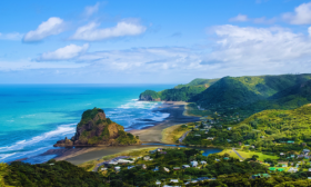 Auckland beach from above shows the sea and some hills