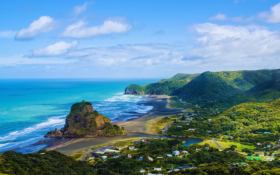 Auckland beach from above shows the sea and some hills